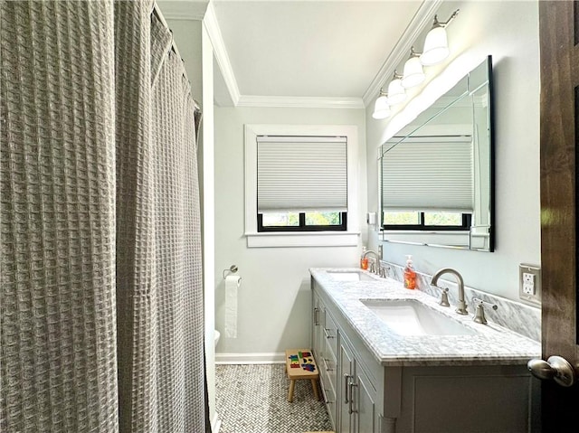 full bathroom featuring ornamental molding, tile patterned flooring, baseboards, and double vanity