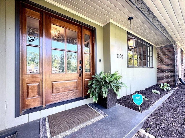 doorway to property featuring covered porch