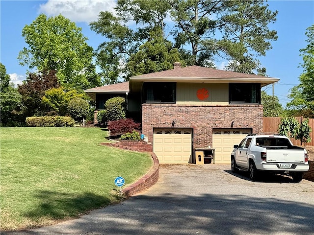 view of property exterior featuring brick siding, an attached garage, asphalt driveway, a chimney, and roof with shingles