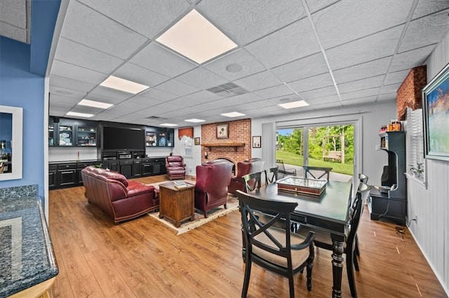 224 Sheffield Rd, Greer, SC 29651 - dining room featuring light wood-type flooring, a fireplace, and a drop ceiling