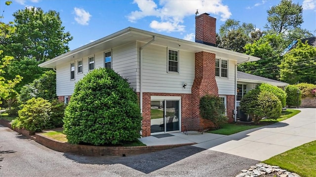 224 Sheffield Rd, Greer, SC 29651 - view of side of property with brick siding and a chimney