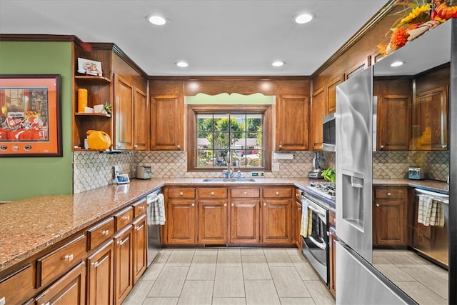 224 Sheffield Rd, Greer, SC 29651 - kitchen with a sink, appliances with stainless steel finishes, open shelves, brown cabinetry, and light stone counters