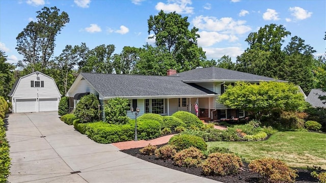 224 Sheffield Rd, Greer, SC 29651 - split level home featuring an outdoor structure, a front yard, a garage, a chimney, and roof with shingles