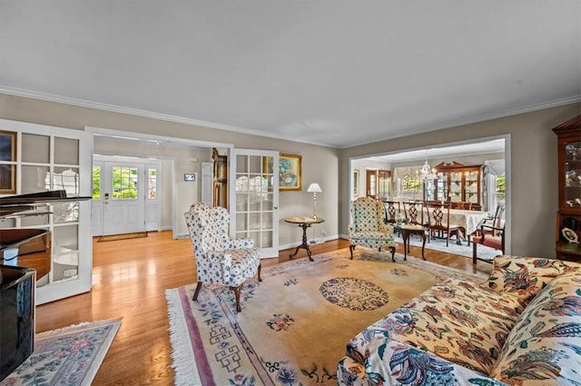 224 Sheffield Rd, Greer, SC 29651 - living area featuring crown molding, wood finished floors, a chandelier, and baseboards