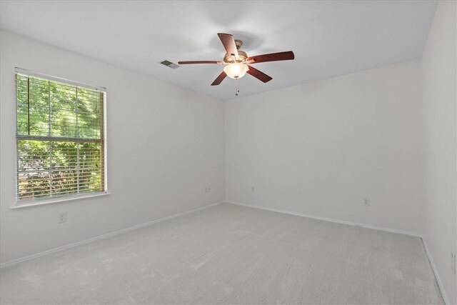 105 Tripmont Ct, Simpsonville, SC 29680 - empty room featuring a ceiling fan, light colored carpet, and baseboards