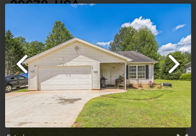 single story home with a front yard, concrete driveway, and a garage