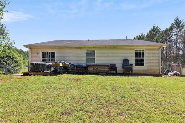 rear view of house featuring a wooden deck