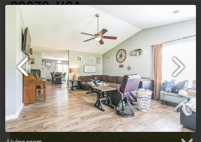 living room with wood finished floors, vaulted ceiling, and ceiling fan