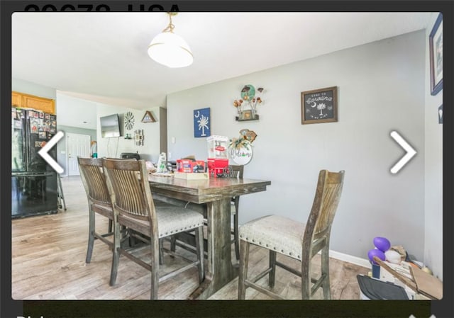 dining area with light wood-style floors