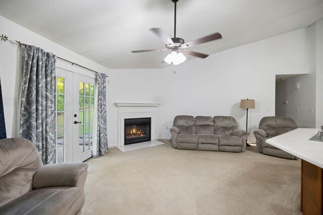 111 Coachman Ct, Anderson, SC 29625 - living area featuring light colored carpet, a glass covered fireplace, a ceiling fan, and french doors