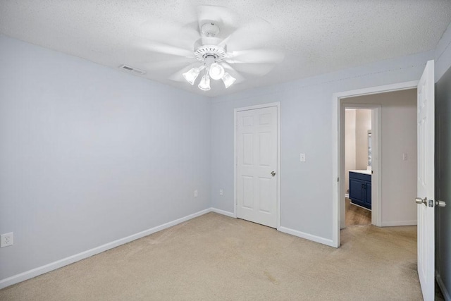111 Coachman Ct, Anderson, SC 29625 - unfurnished bedroom with light carpet, a textured ceiling, baseboards, and ceiling fan