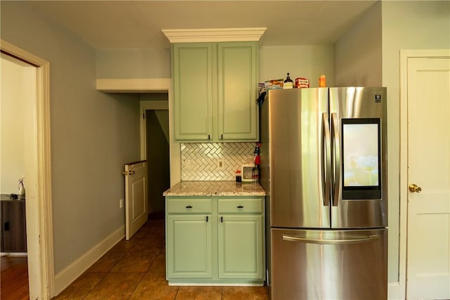 kitchen with smart refrigerator, green cabinets, tasteful backsplash, and dark tile patterned floors