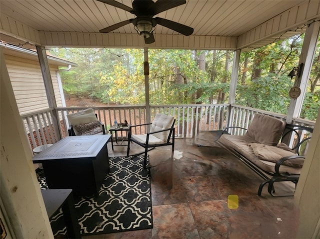 sunroom / solarium with ceiling fan, plenty of natural light, and outdoor lounge area