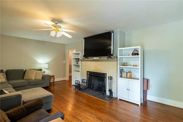 100 Berkeley Ct, Clemson, SC 29631 - living area featuring a tiled fireplace, wood finished floors, a ceiling fan, and baseboards