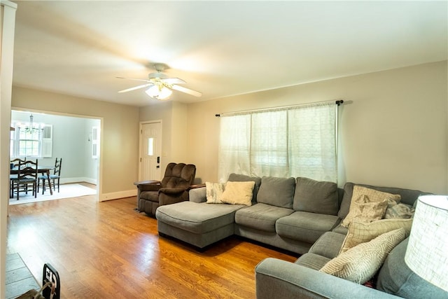 100 Berkeley Ct, Clemson, SC 29631 - living area with a chandelier, wood finished floors, ceiling fan, and baseboards