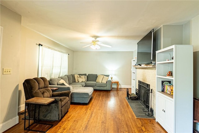 100 Berkeley Ct, Clemson, SC 29631 - living room with a tiled fireplace, ceiling fan, wood finished floors, and baseboards