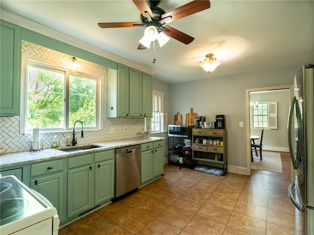 100 Berkeley Ct, Clemson, SC 29631 - kitchen featuring stainless steel appliances, green cabinetry, tasteful backsplash, and a sink