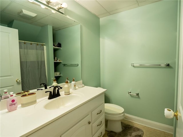 100 Berkeley Ct, Clemson, SC 29631 - full bath featuring vanity, tile patterned floors, toilet, baseboards, and a paneled ceiling