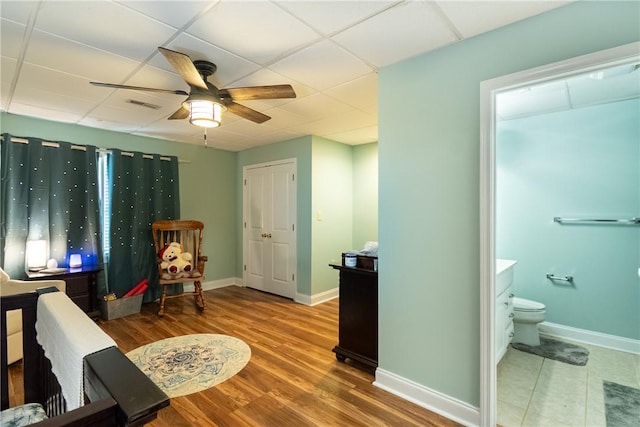 100 Berkeley Ct, Clemson, SC 29631 - bedroom with a paneled ceiling, baseboards, wood finished floors, ensuite bath, and a ceiling fan