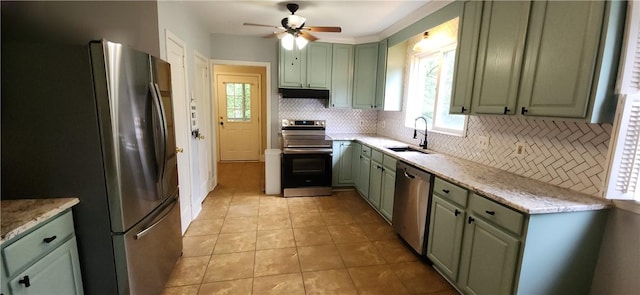 100 Berkeley Ct, Clemson, SC 29631 - kitchen featuring stainless steel appliances, green cabinets, a sink, and tasteful backsplash