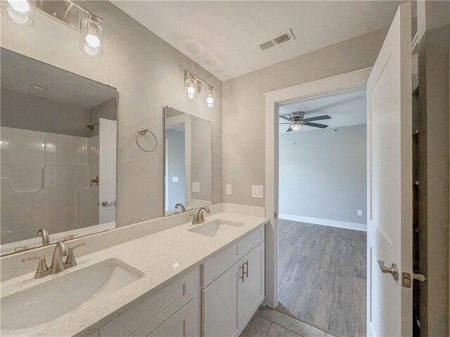 324 Code Cir, Seneca, SC 29678 - full bathroom featuring a ceiling fan, a shower, double vanity, and tile patterned flooring