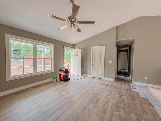 324 Code Cir, Seneca, SC 29678 - empty room with lofted ceiling, light wood finished floors, a ceiling fan, and baseboards