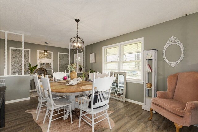203 Greenmeadow Cir, Anderson, SC 29626 - dining space featuring wood finished floors, baseboards, a chandelier, and a fireplace