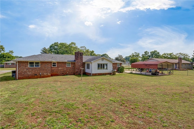203 Greenmeadow Cir, Anderson, SC 29626 - rear view of house featuring a carport, a chimney, and brick siding
