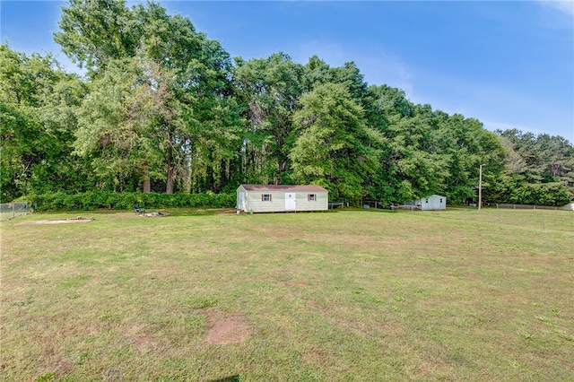 203 Greenmeadow Cir, Anderson, SC 29626 - view of yard with a storage shed, an outbuilding, and a forest view
