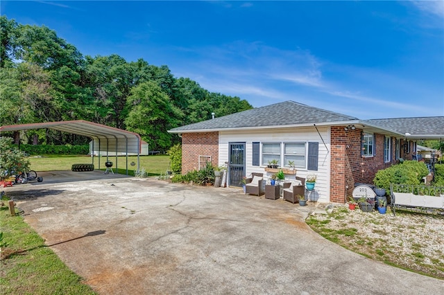 203 Greenmeadow Cir, Anderson, SC 29626 - view of property exterior with brick siding, a carport, a lawn, driveway, and roof with shingles