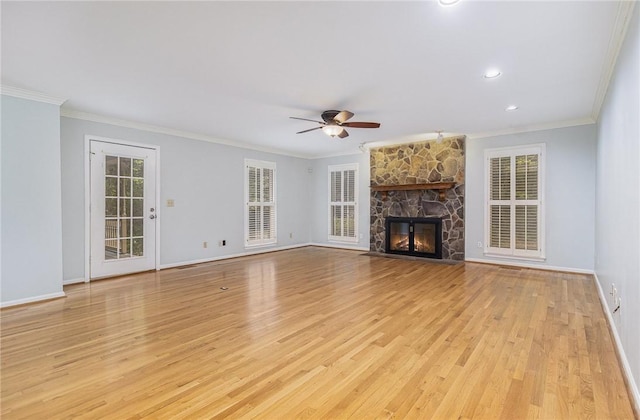 503 Columbine Ct, Easley, SC 29642 - unfurnished living room featuring ornamental molding, ceiling fan, light wood-type flooring, baseboards, and a stone fireplace