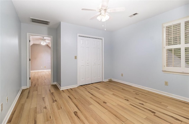 503 Columbine Ct, Easley, SC 29642 - unfurnished bedroom featuring light wood finished floors, baseboards, a closet, and a ceiling fan