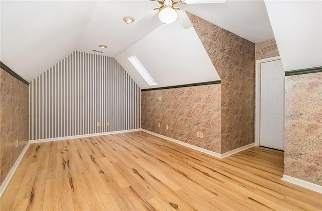 503 Columbine Ct, Easley, SC 29642 - bonus room with hardwood / wood-style flooring, wallpapered walls, lofted ceiling, a ceiling fan, and baseboards