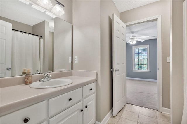 205 Washington Ave, Easley, SC 29640 - full bathroom with tile patterned flooring, a ceiling fan, baseboards, and vanity