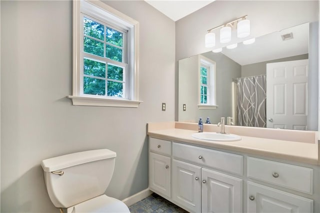 205 Washington Ave, Easley, SC 29640 - full bathroom with baseboards, toilet, vanity, and a shower with shower curtain