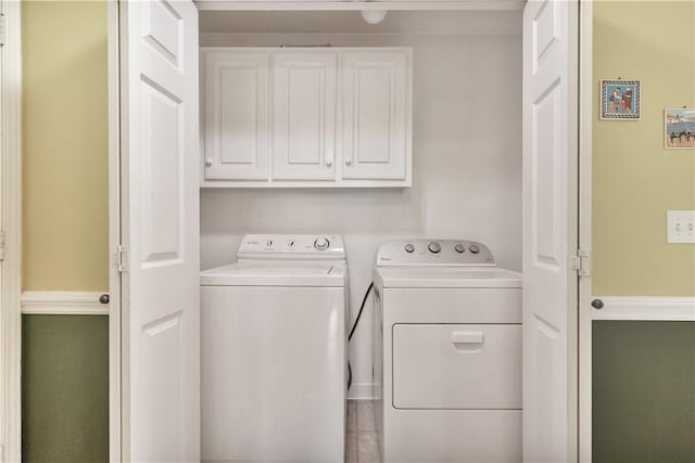 205 Washington Ave, Easley, SC 29640 - laundry area featuring washing machine and clothes dryer and cabinet space