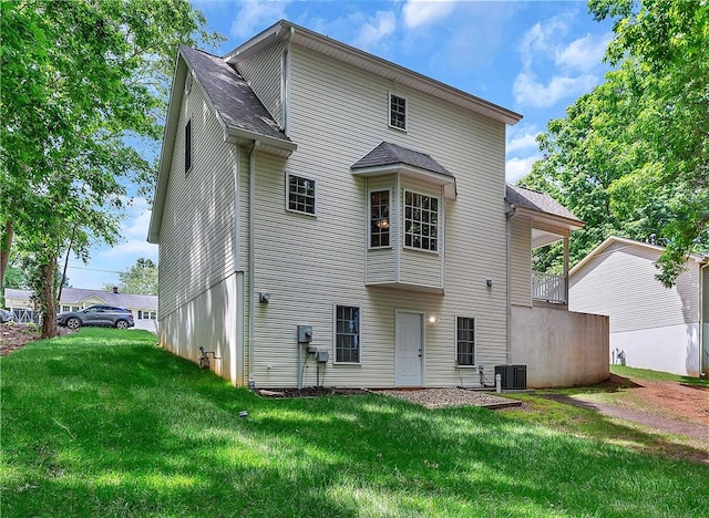 205 Washington Ave, Easley, SC 29640 - rear view of property with cooling unit, a lawn, and roof with shingles