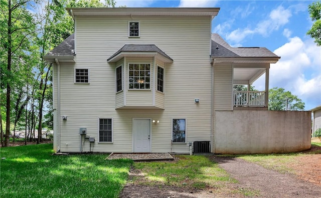 205 Washington Ave, Easley, SC 29640 - rear view of house with roof with shingles, a lawn, and cooling unit