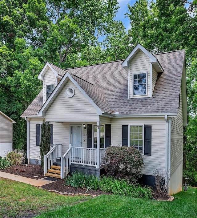 205 Washington Ave, Easley, SC 29640 - cape cod-style house featuring a porch and a shingled roof