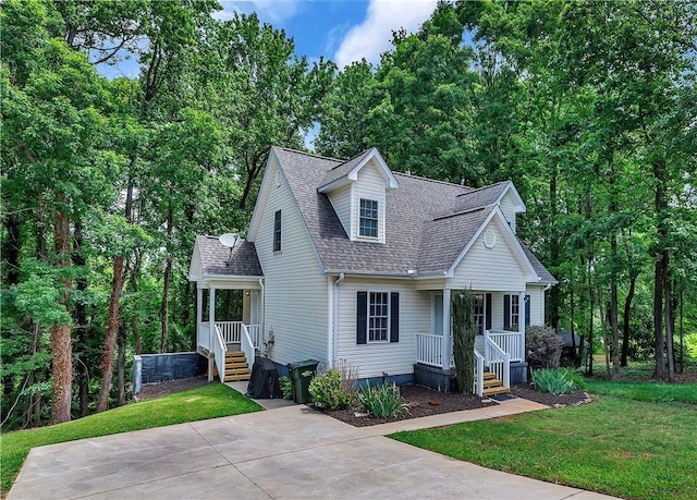 205 Washington Ave, Easley, SC 29640 - view of front of home with a porch, a shingled roof, and a front yard