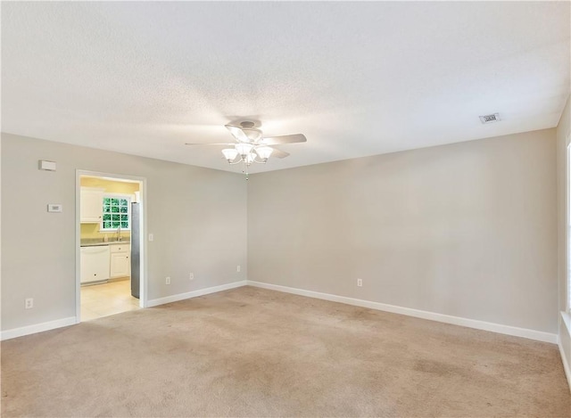 205 Washington Ave, Easley, SC 29640 - empty room featuring a ceiling fan, light colored carpet, baseboards, and a sink
