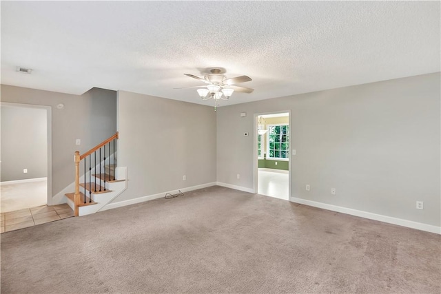 205 Washington Ave, Easley, SC 29640 - carpeted empty room with ceiling fan, stairway, baseboards, and a textured ceiling
