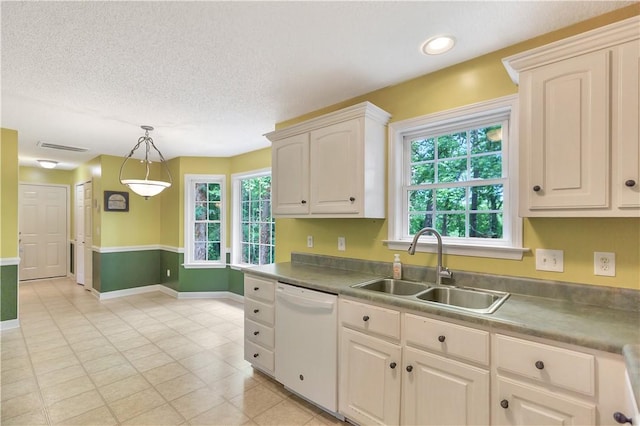 205 Washington Ave, Easley, SC 29640 - kitchen featuring white dishwasher, a sink, decorative light fixtures, baseboards, and light tile patterned floors