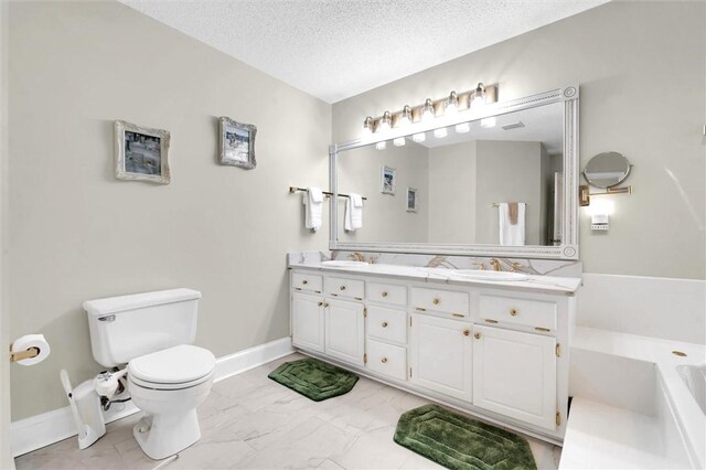 full bath featuring toilet, a bath, marble look tile flooring, double vanity, and a textured ceiling