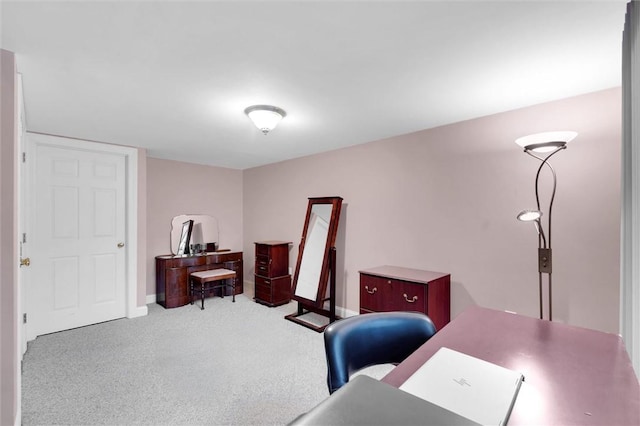carpeted office space with baseboards