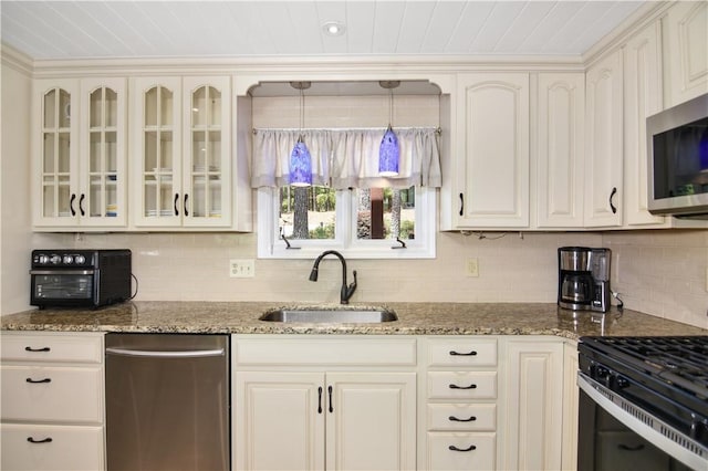 32 Par Harbor Way, Salem, SC 29676 - kitchen with a sink, appliances with stainless steel finishes, glass insert cabinets, and backsplash