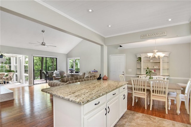 32 Par Harbor Way, Salem, SC 29676 - kitchen with a chandelier, open floor plan, lofted ceiling, light stone counters, and recessed lighting