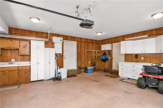 32 Par Harbor Way, Salem, SC 29676 - garage with a sink, a garage door opener, and wood walls