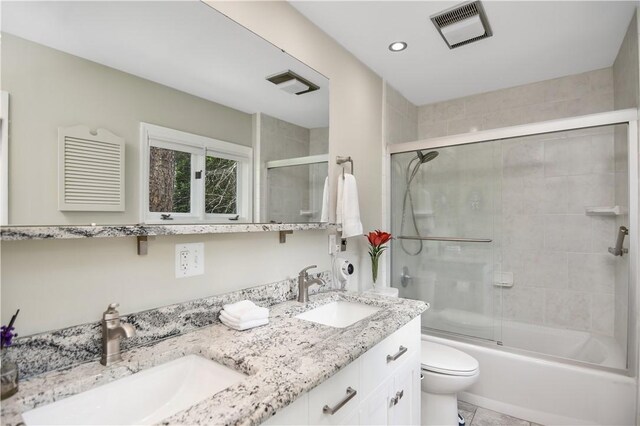 32 Par Harbor Way, Salem, SC 29676 - bathroom featuring toilet, double vanity, bath / shower combo with glass door, and tile patterned flooring