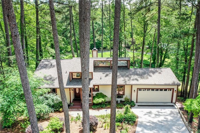 32 Par Harbor Way, Salem, SC 29676 - mid-century inspired home with a chimney, driveway, an attached garage, a shingled roof, and a porch